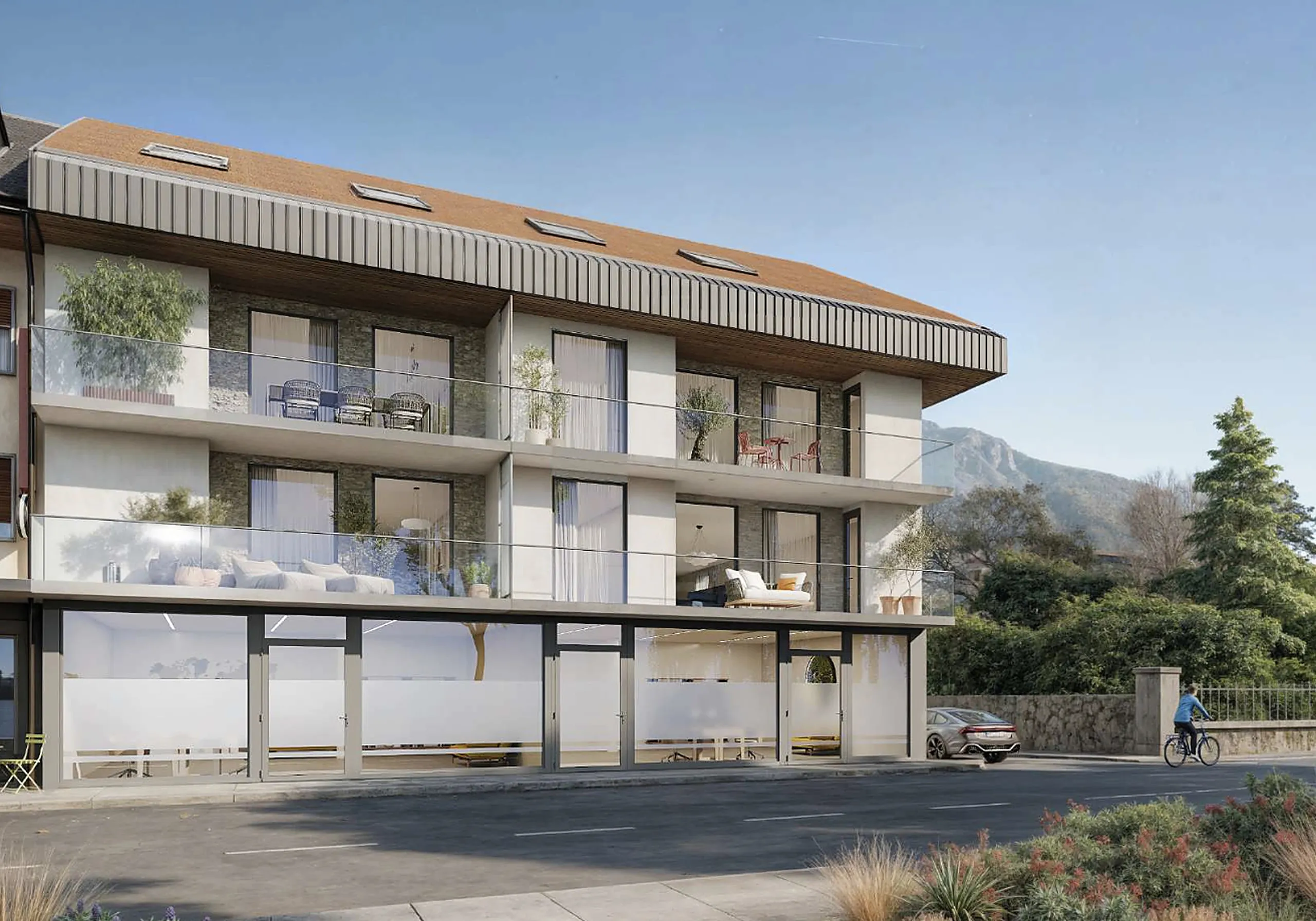 Gebäude des Projekts Grand-Rive in Villeneuve mit Balkonen und Gewerbe im Erdgeschoss