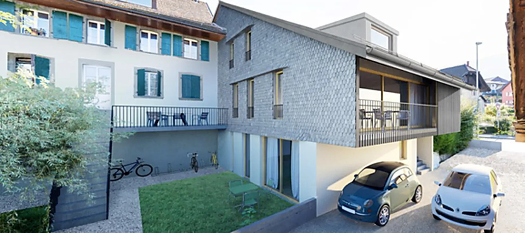 Gebäude des Projekts Belle-Maison im alten Ortskern von Blonay mit Schindelfassade und Innenhof